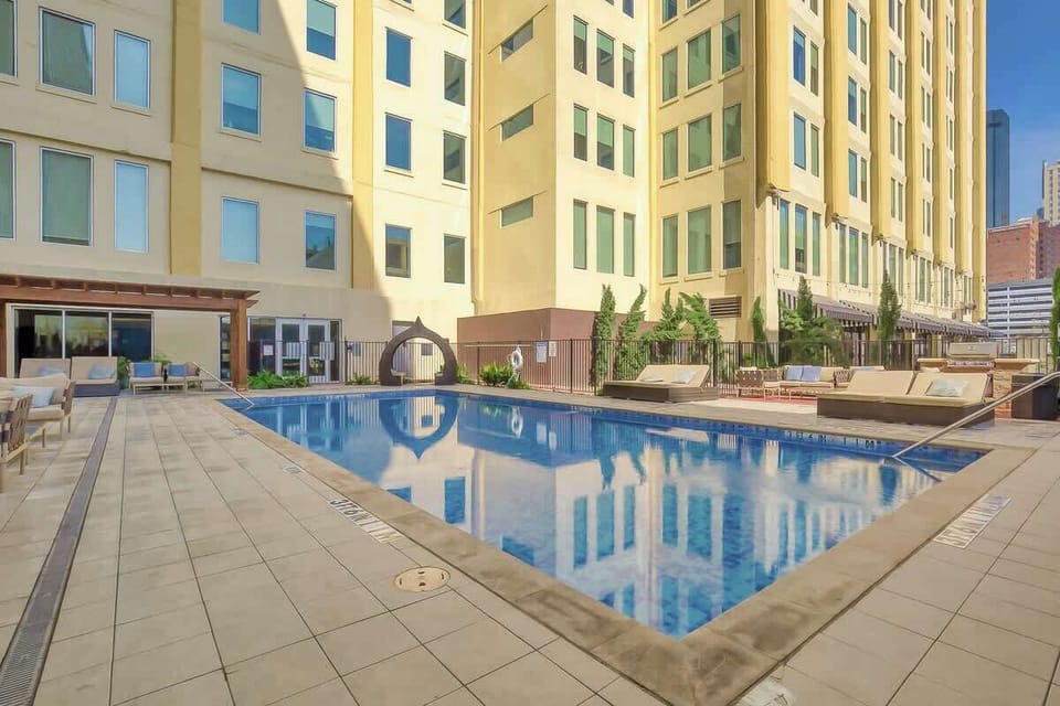 Pool Oasis: Dive into relaxation at this stunning pool surrounded by chic lounge seating!