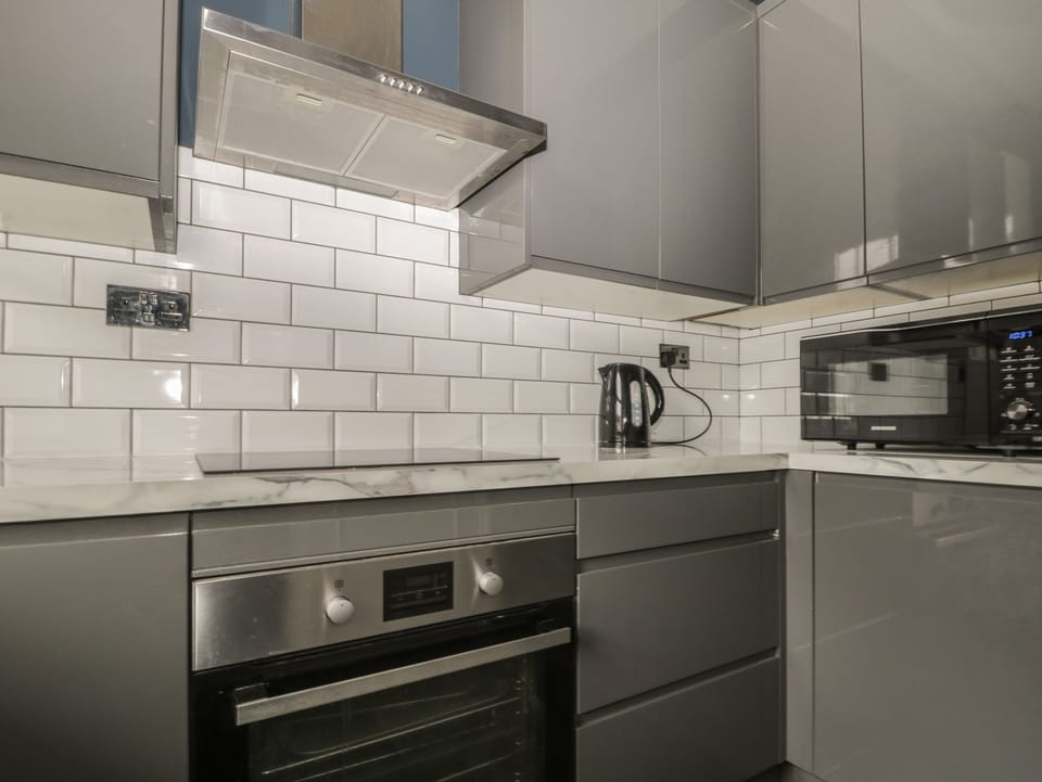 Fridge, electric kettle, toaster, cookware/dishes/utensils