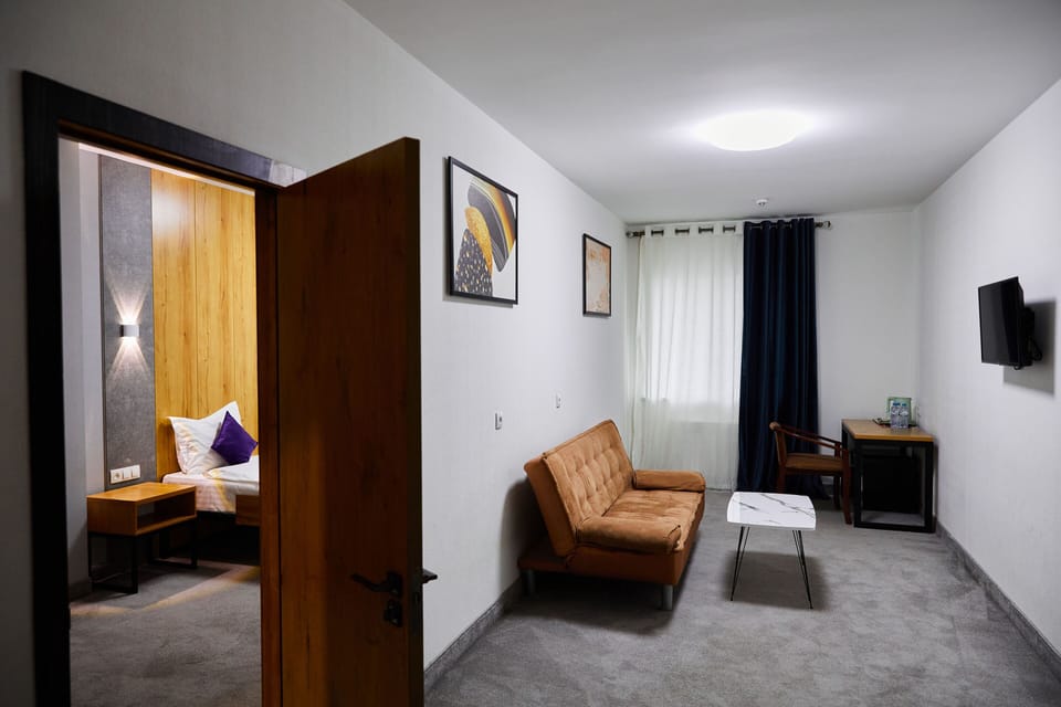 Family Room | Premium bedding, desk, blackout drapes, soundproofing