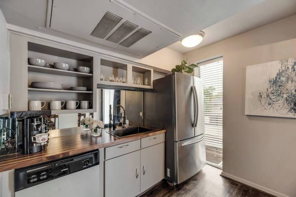 Spacious kitchen with sleek, modern appliances, fully equipped for all your cooking and dining needs.