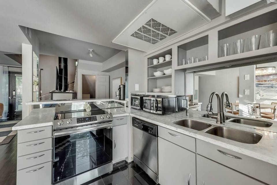 Spacious kitchen with sleek, modern appliances, fully equipped for all your cooking and dining needs.