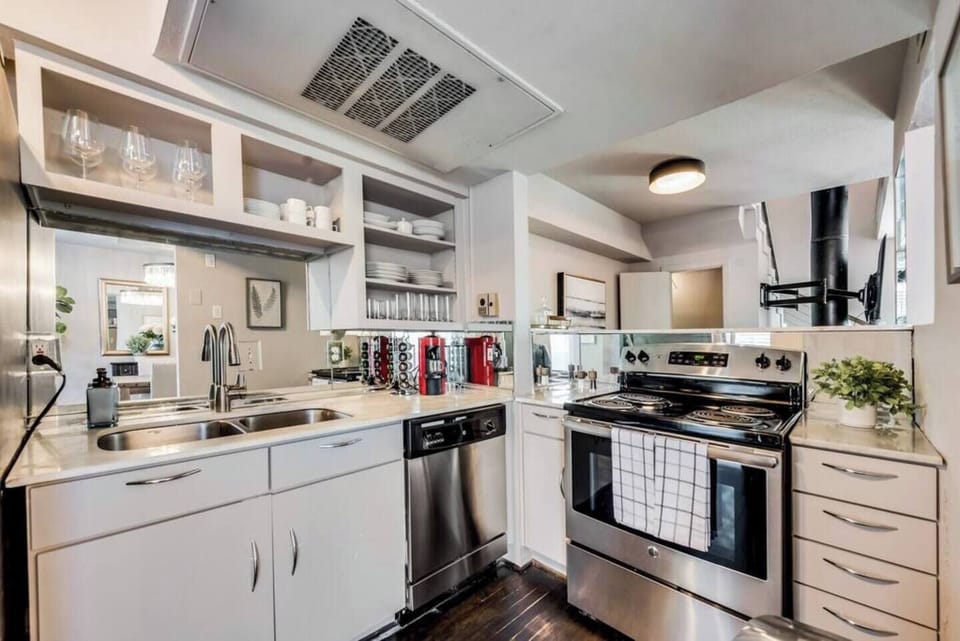 Spacious kitchen with sleek, modern appliances, fully equipped for all your cooking and dining needs.