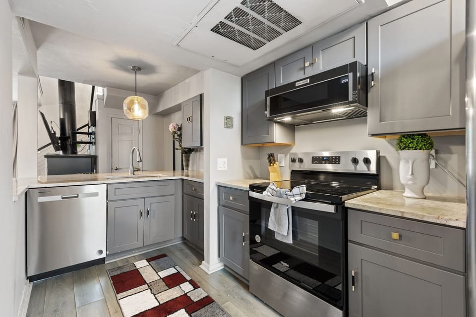Spacious kitchen with sleek, modern appliances, fully equipped for all your cooking and dining needs.