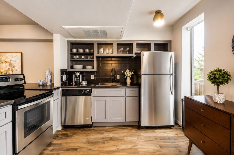 Spacious kitchen with sleek, modern appliances, fully equipped for all your cooking and dining needs.