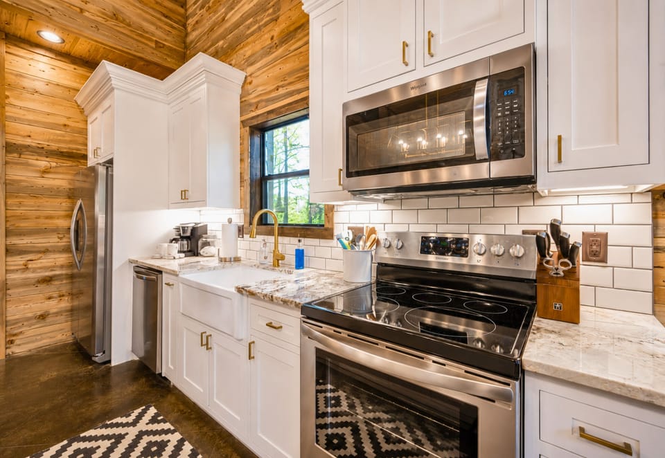Whip up delicious meals in our kitchen that blends modern appliances with rustic charm.