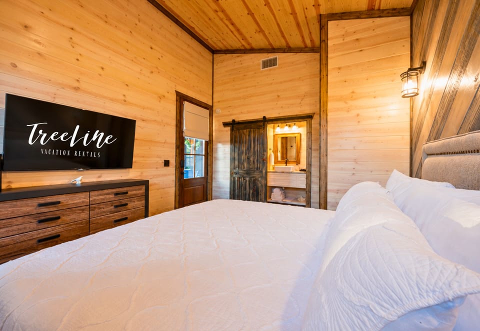 Relax in a room that feels like a cozy cabin with all the modern luxuries.