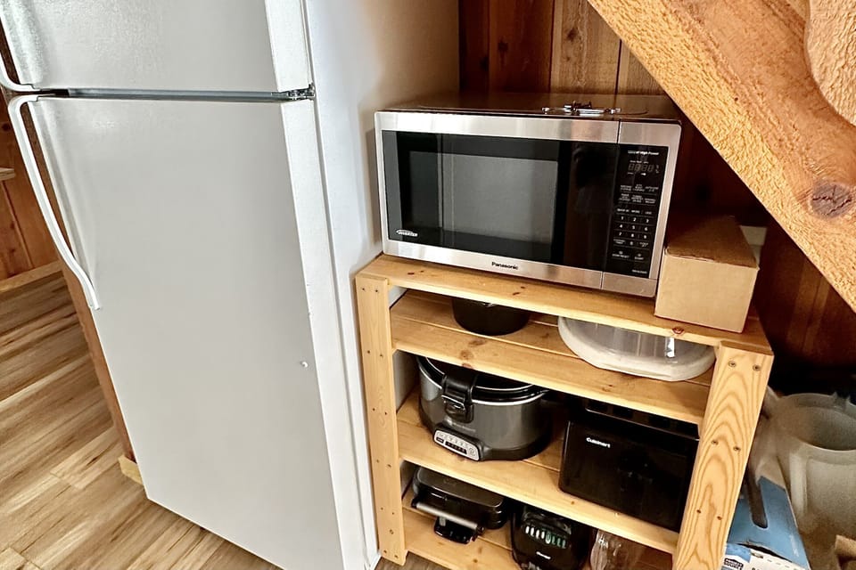Full size fridge and cookware.