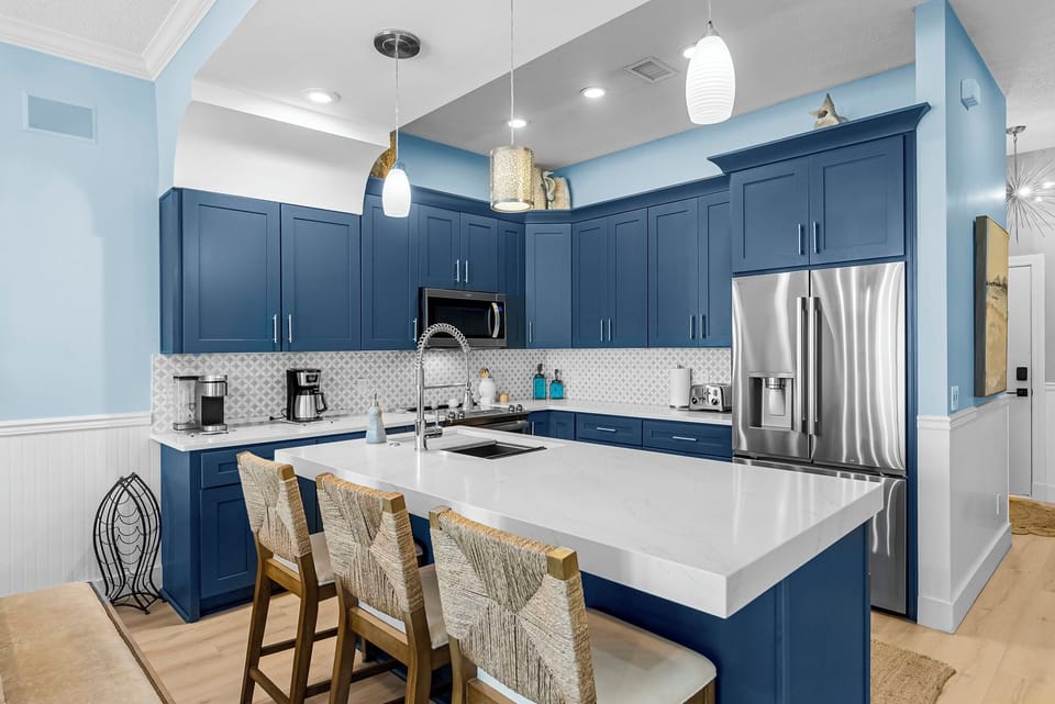 Fully equipped gourmet kitchen with granite countertops, stainless appliances, and everything needed for a group meal, plus a wine cooler/ice maker & kitchenette. 