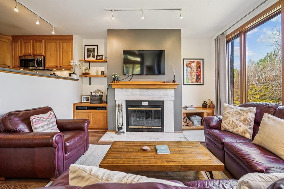 The spacious layout flows seamlessly from the living room to the fully equipped kitchen, making it easy to gather, cook, and spend time together.