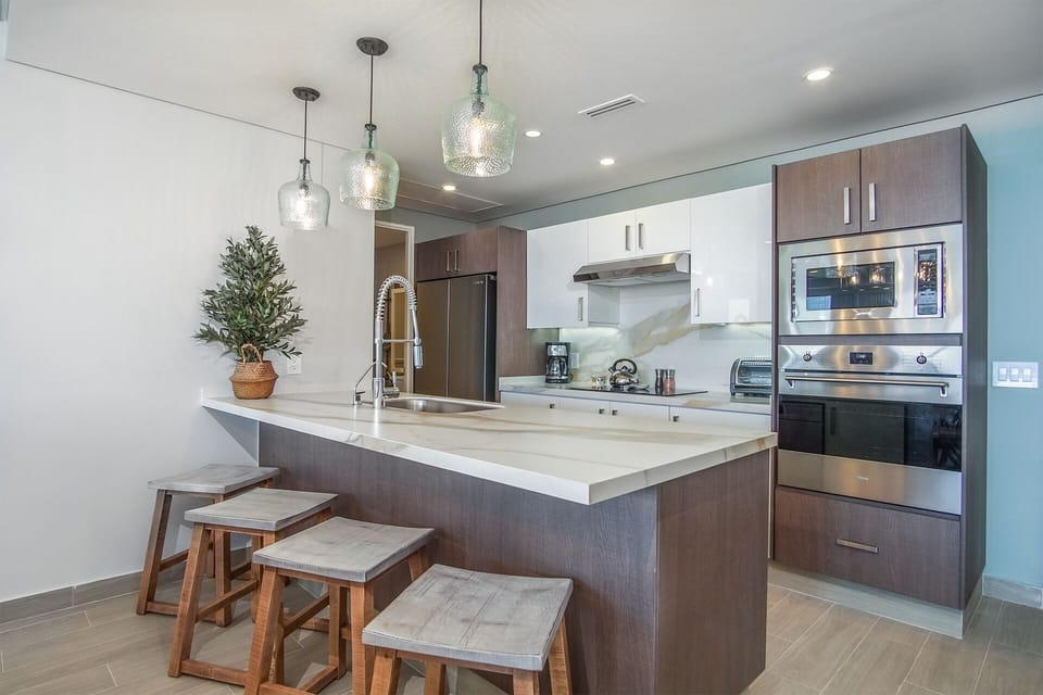 great wooden stools at the large kitchen counter
