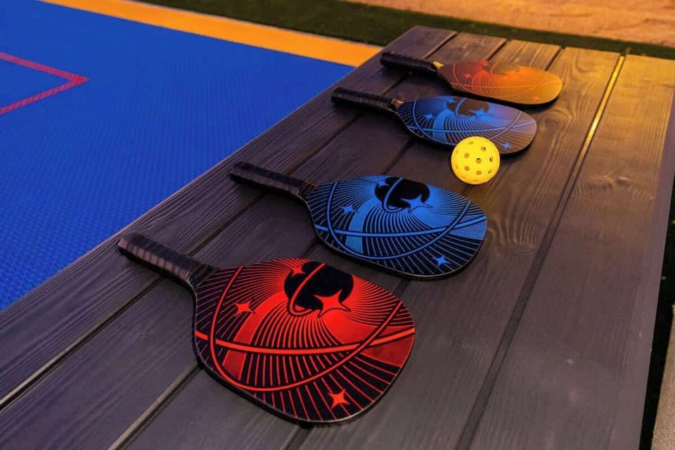 Pickleball awaits! Grab a paddle and ball, and enjoy a friendly match on the colorful court just steps away.