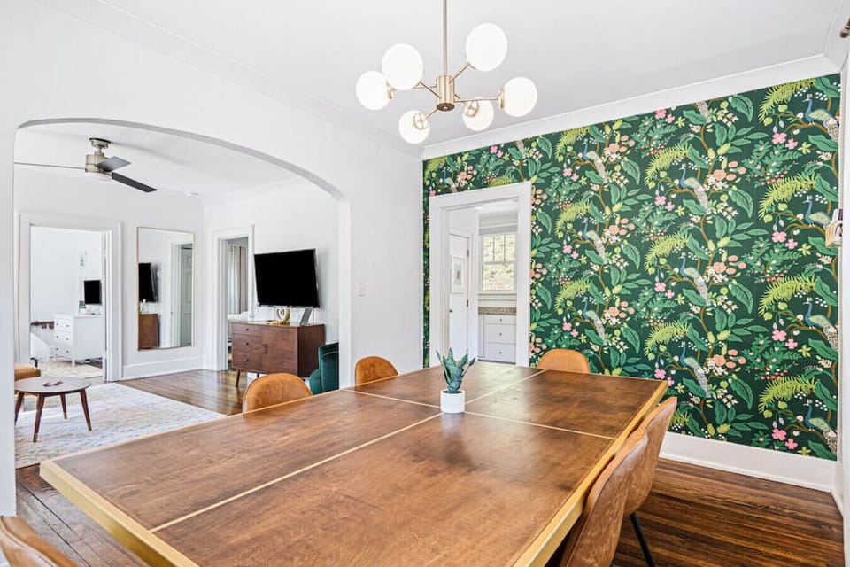 Dining room with seating for 6 at the dining table. The dining table also doubles as a ping pong table! Ping ping items located in the basket on the wall.