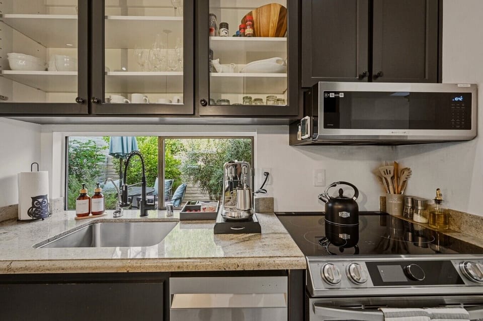 Fully stocked for extended stays. From wine glasses and serving pieces to cookware and essentials, this kitchen is equipped for everything from quick bites to full meals in wine country.