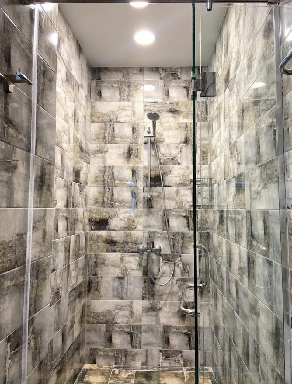 Jetted tub, rainfall showerhead, designer toiletries, hair dryer