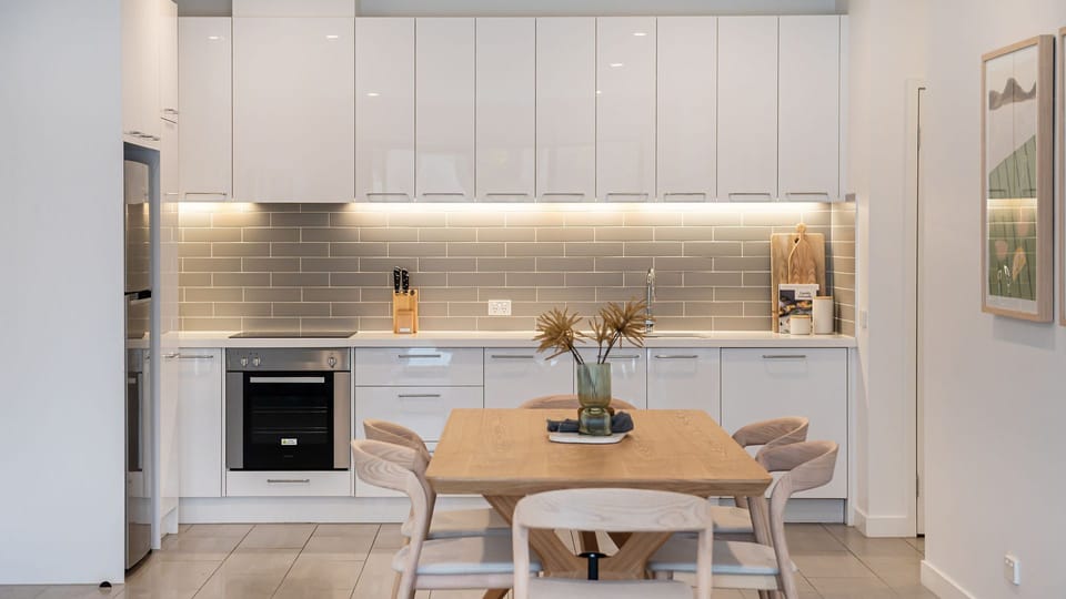 Two steps from the table to the kitchen. Can't get any easier. 