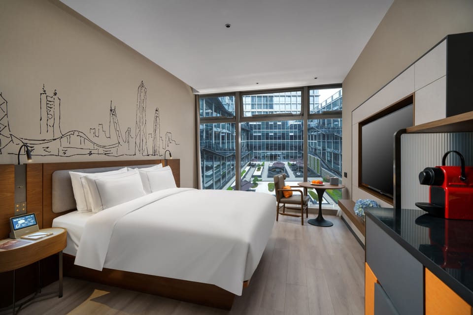 Queen Room with Garden View | Premium bedding, free minibar, laptop workspace, blackout drapes