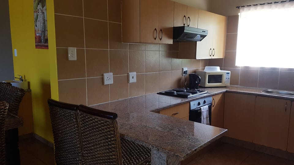 Executive Chalet | Private kitchen | Fridge, microwave, oven, stovetop