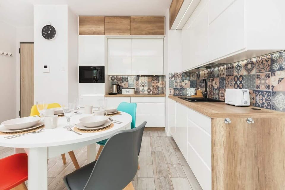 A different view of the kitchen space, highlighting a mix of functional furniture and decor.