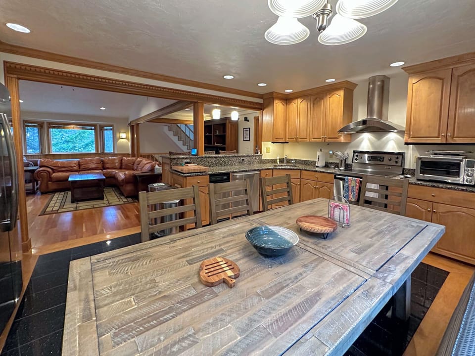 Kitchen with stainless appliances and dining table