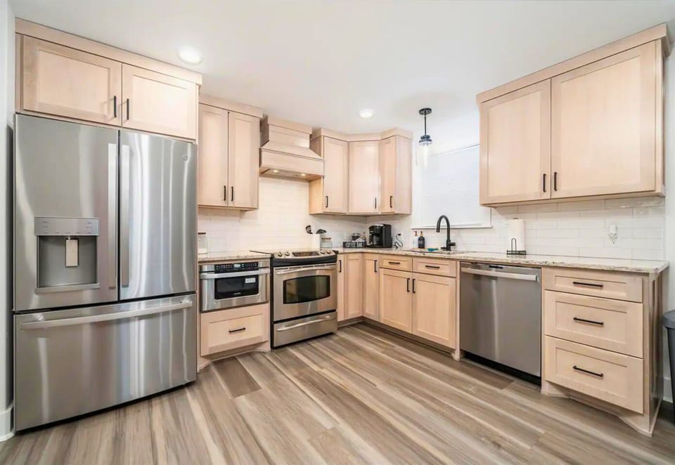 Spacious kitchen with stainless steel appliances.