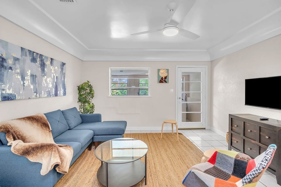 Unwind in the stylish and spacious living area, equipped with plush seats, great lighting, and wide screen TV. A perfect setup for catching up on your favorite TV shows or enjoying a movie marathon.