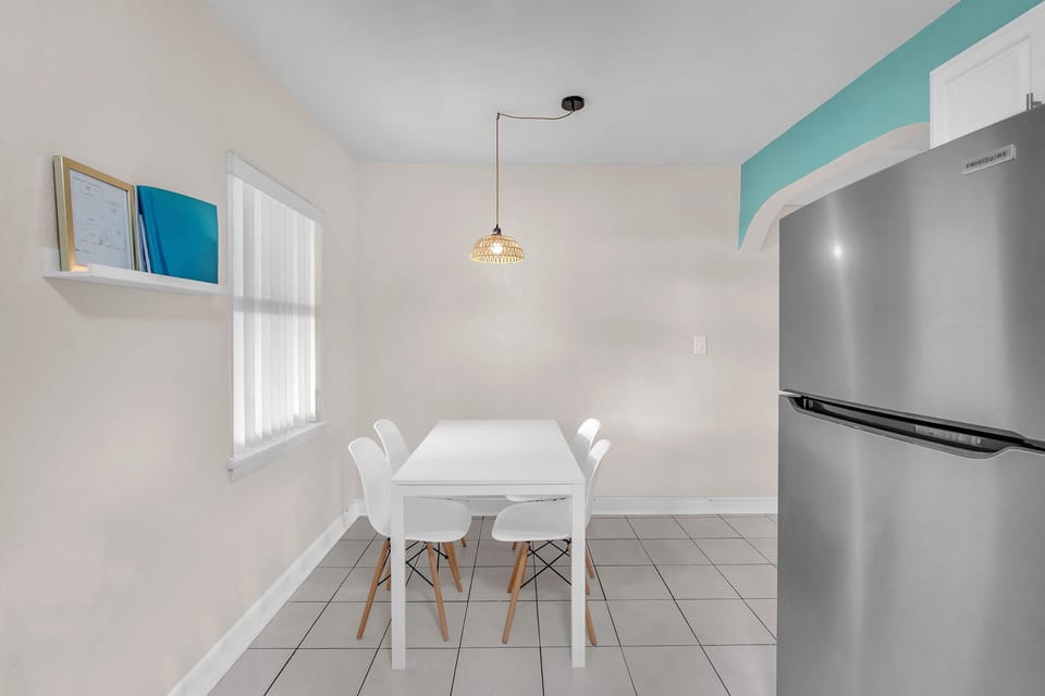 Dining area provides a cozy setting for your meals and can comfortably accommodate up to four people.