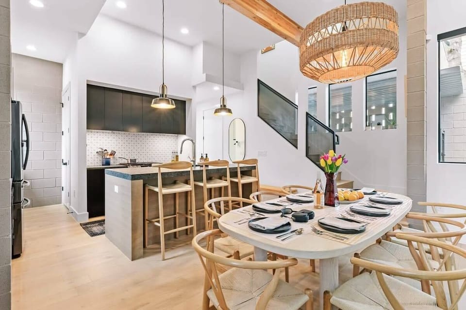 Dining area and kitchen with stairs to second floor
