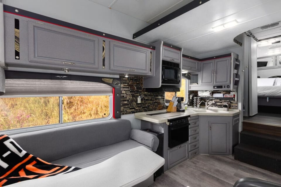 Relax and watch TV or play some games in the living room area!