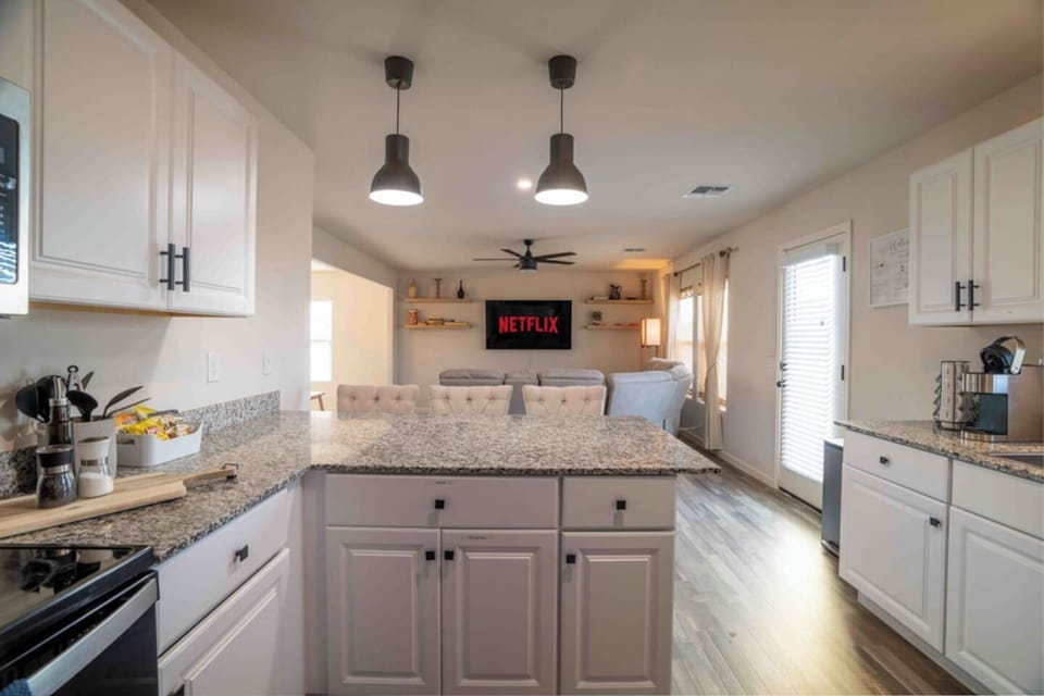 Kitchen with granite countertops and ample cabinet storage.