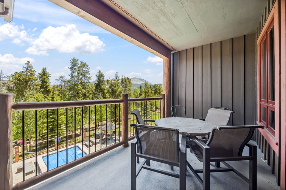 Your private balcony overlooks the heated pool and the Tenmile Range