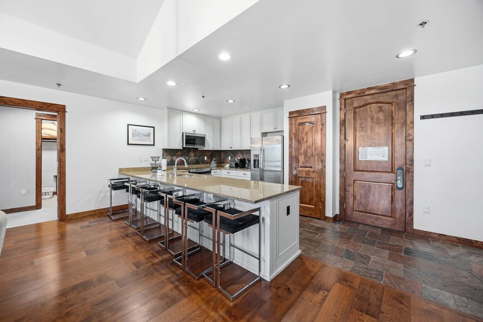 Cook + entertain — the bar seats your crew while you're at the range