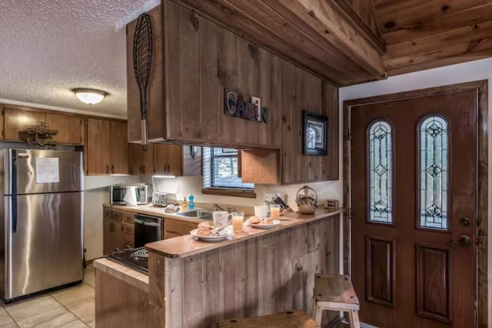 Barstool seating and kitchen
