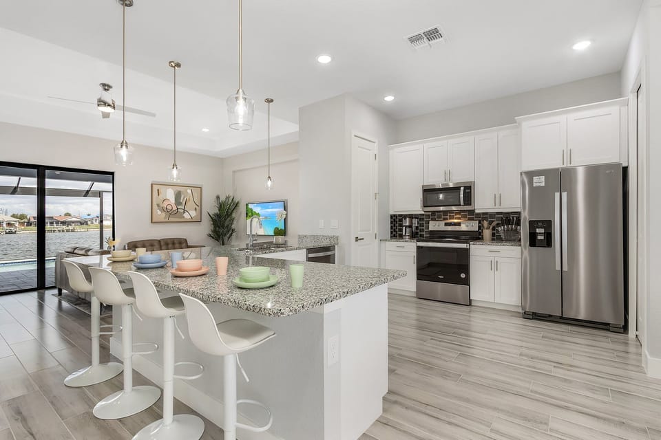 Modern kitchen with sleek appliances and spacious island for family gatherings
