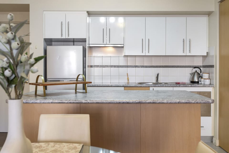 This well-equipped kitchen is perfect for cooking up a delicious meal. Enjoy the modern appliances and ample counter space.