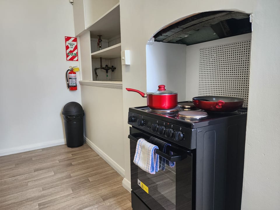 Signature Apartment | Private kitchen | Full-size fridge, microwave, oven, stovetop