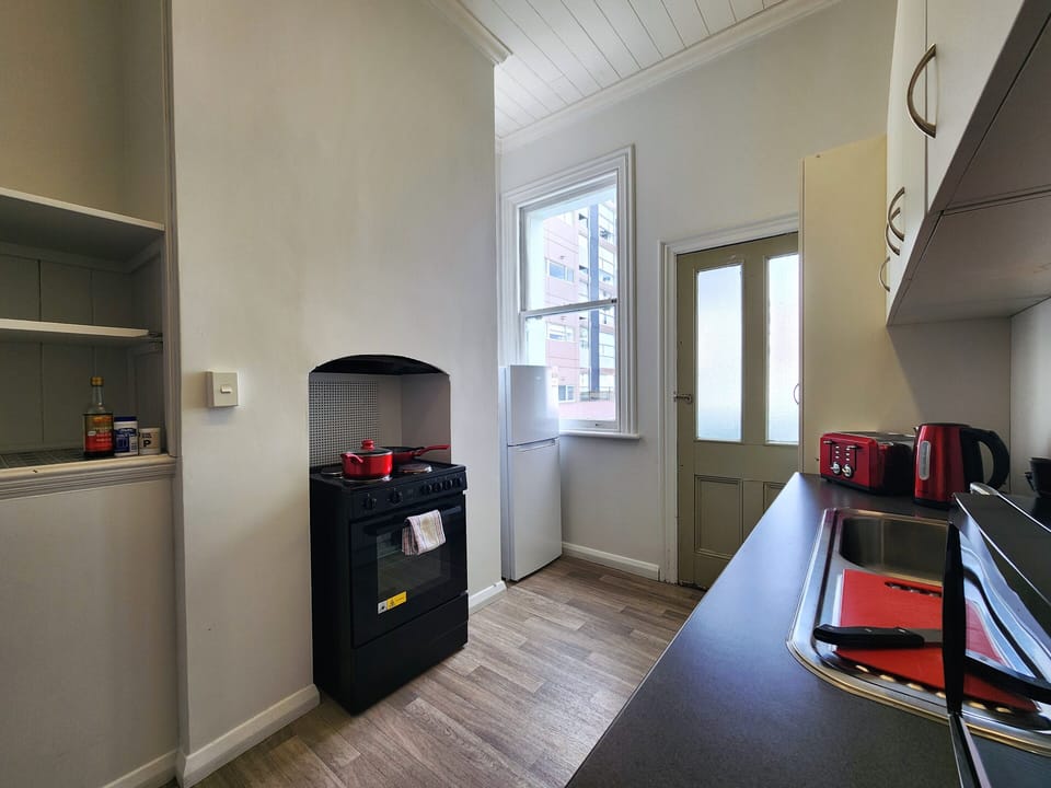 Signature Apartment | Private kitchen | Full-size fridge, microwave, oven, stovetop