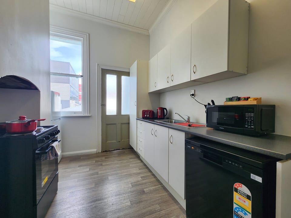 Signature Apartment | Private kitchen | Full-size fridge, microwave, oven, stovetop
