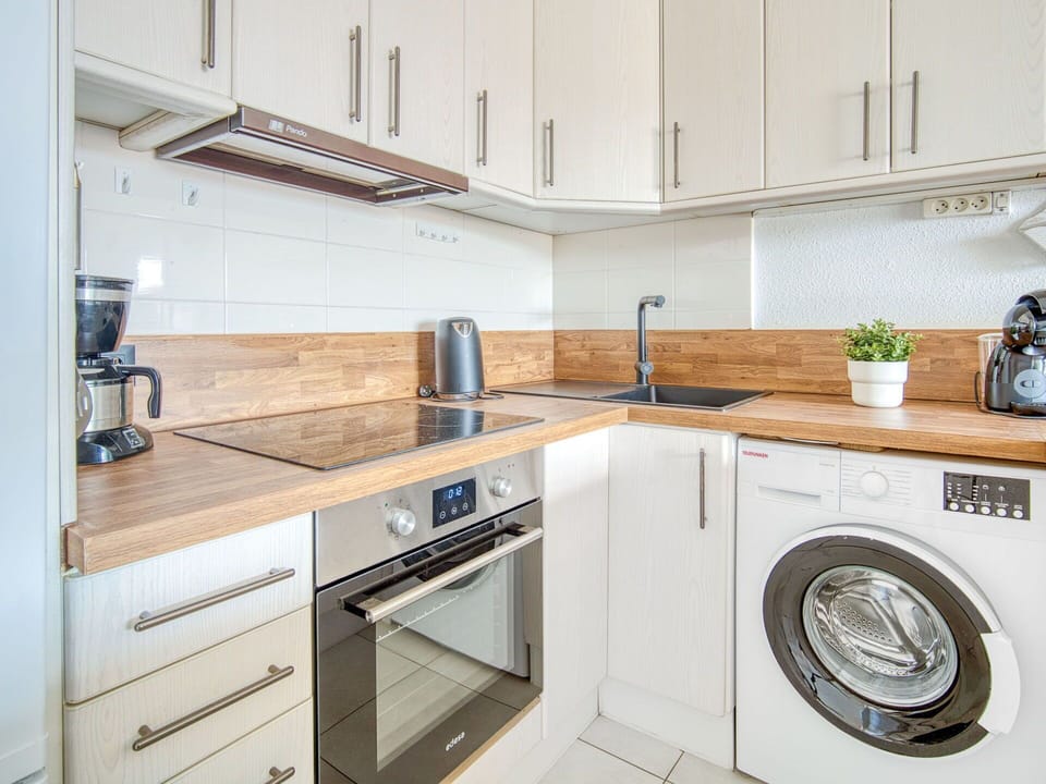 Countertop, Kitchen, Flooring, Cabinetry, Major Appliance, Interior Design, Kitchen Appliance, Wood, Floor, Furniture