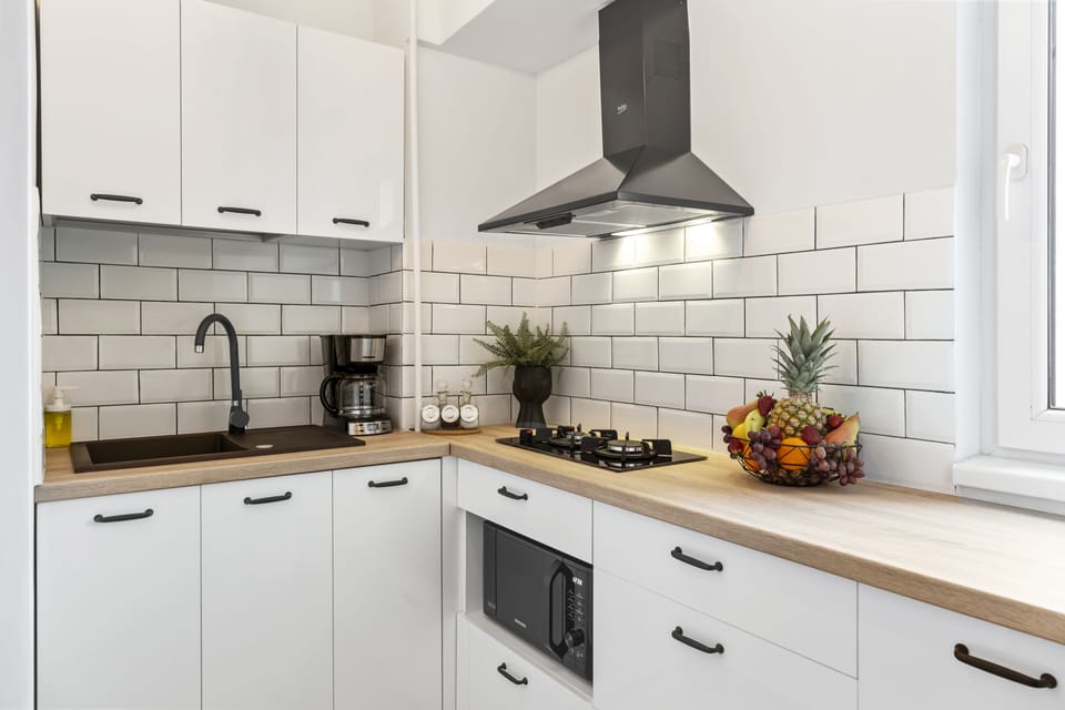Exclusive Apartment | Private kitchen | Mini-fridge, microwave, cookware/dishes/utensils, cleaning supplies