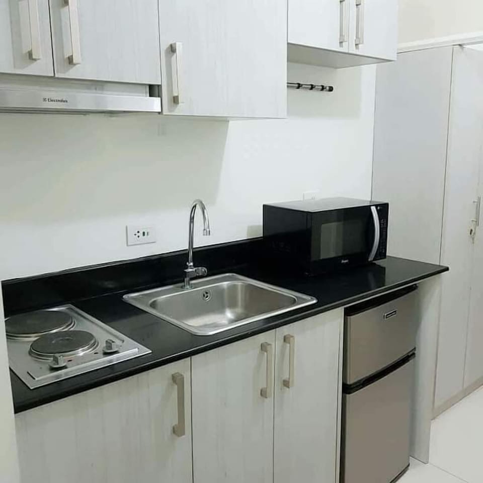 Economy Condo | Private kitchen | Cookware/dishes/utensils, dining tables