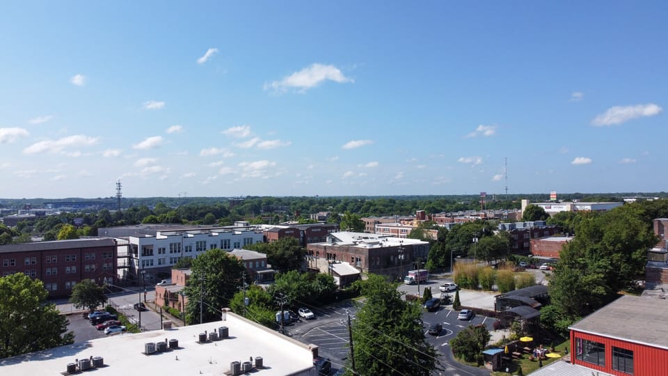 Wide neighborhood views stretching across rooftops & tree-lined streets