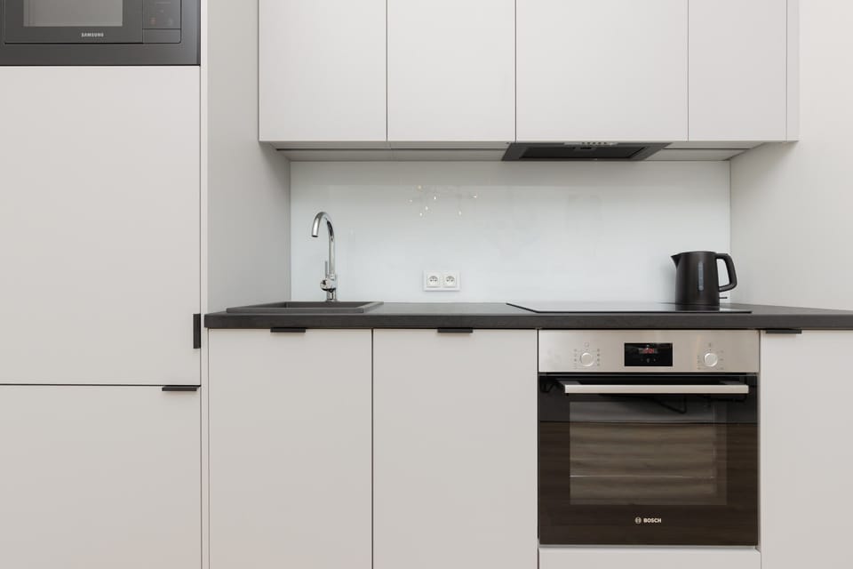 A detailed view of the kitchen counter, sink, and storage, highlighting functionality and style.