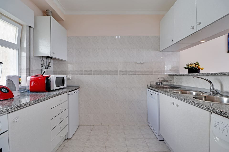 Apartment, 2 Bedrooms, Smoking, Pool Access | Private kitchen | Microwave, oven, dishwasher, coffee/tea maker