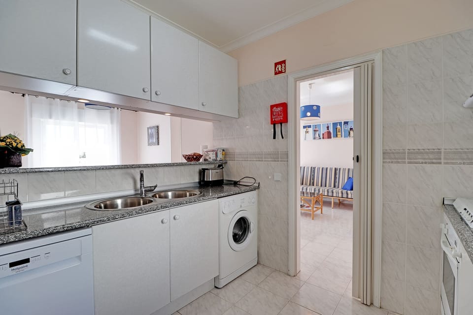 Apartment, 2 Bedrooms, Smoking, Pool Access | Private kitchen | Microwave, oven, dishwasher, coffee/tea maker