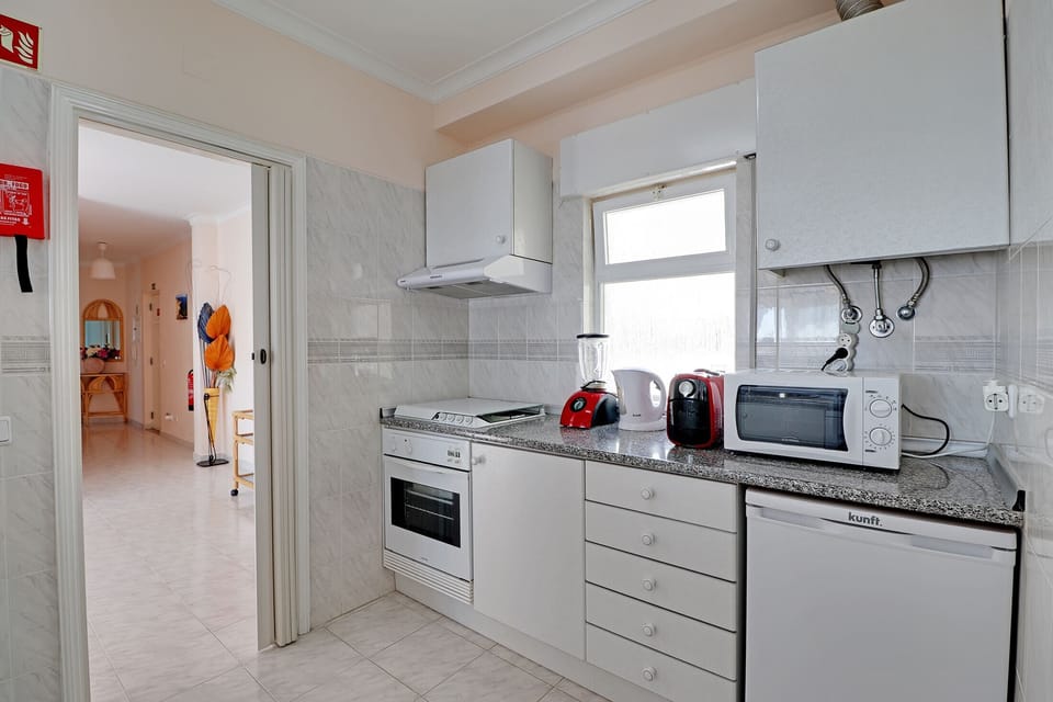 Apartment, 2 Bedrooms, Smoking, Pool Access | Private kitchen | Microwave, oven, dishwasher, coffee/tea maker