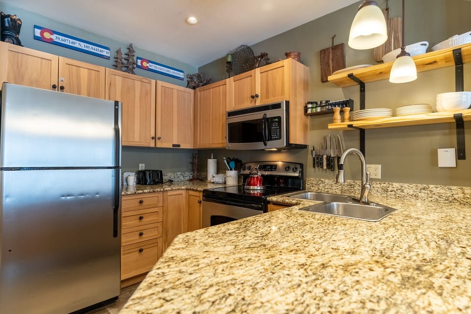 Your fully equipped kitchen features granite countertops, stainless steel appliances, and everything you need to create memorable meals together.