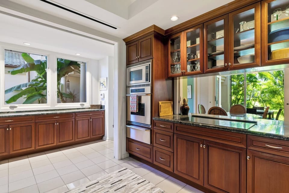 Sunlit mornings and savory evenings begin in this warm, refined kitchen