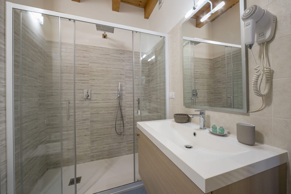 City Apartment, 1 Bedroom (Via Rodari 6) | Bathroom | Shower, rainfall showerhead, free toiletries, hair dryer