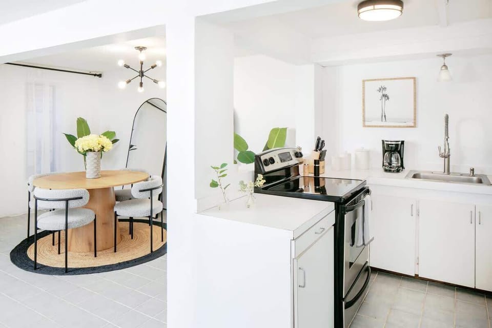 Chic eat-in kitchen w/ modern appliances & circular dining area. Your stylish space to cook & dine!