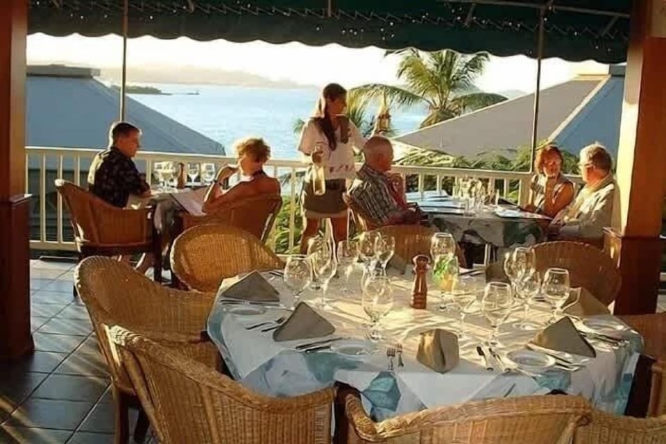 Dine with a view: Enjoy exquisite meals on a charming terrace overlooking the sea.